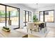 Bright dining area with a modern table, ample natural light, and backyard view at 2190 Vine Ave, Boulder, CO 80304