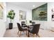 Dining room features a glass table with seating for four, with a wet bar in the background at 2190 Vine Ave, Boulder, CO 80304