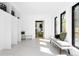 Bright entryway with white walls, benches, storage shelves, and large windows at 2190 Vine Ave, Boulder, CO 80304