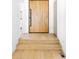 View of foyer featuring a light wood door and flooring, with white walls and modern staircase at 2190 Vine Ave, Boulder, CO 80304