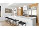 Bright kitchen with large island, seating, stainless steel appliances and modern pendant lighting at 2190 Vine Ave, Boulder, CO 80304