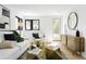 Bright open-concept living room with modern furnishings, light wood floors, and a view to the outside at 2190 Vine Ave, Boulder, CO 80304