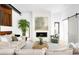 Cozy living room featuring a fireplace, comfortable seating, and abundant natural light at 2190 Vine Ave, Boulder, CO 80304