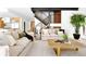 Bright, open living room with hardwood floors, a modern staircase, and stylish decor at 2190 Vine Ave, Boulder, CO 80304