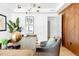 Bright home office with a desk, leather chair, and modern light fixture at 2190 Vine Ave, Boulder, CO 80304