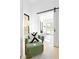 Cozy sitting area nook, featuring a comfortable green chair and natural light from a window at 2190 Vine Ave, Boulder, CO 80304