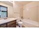 Full bathroom with tiled shower-tub combo and single sink vanity with mirror at 2370 Redwood Ave, Lafayette, CO 80026