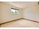 Bedroom featuring neutral carpet, a window with treetop view, and neutral walls at 2370 Redwood Ave, Lafayette, CO 80026