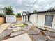 Landscaped backyard featuring stone pathways and a shed at 1694 Xanthia St, Denver, CO 80220