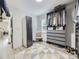 Walk-in closet featuring modern storage and organization at 1694 Xanthia St, Denver, CO 80220