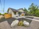 Charming home featuring modern landscape with native plants and stones at 1694 Xanthia St, Denver, CO 80220