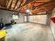 Spacious garage interior with high ceilings, ample storage, and a convenient workspace at 1694 Xanthia St, Denver, CO 80220