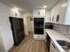 Updated kitchen features stainless steel appliances and white cabinets at 1694 Xanthia St, Denver, CO 80220