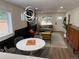 Bright and airy living space featuring stylish lighting fixture and seamlessly connecting to modern decor at 1694 Xanthia St, Denver, CO 80220