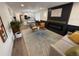 Spacious living area flowing from the modern kitchen, showcasing the open-concept layout and stylish decor at 1694 Xanthia St, Denver, CO 80220