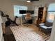 Bright office space with a colorful rug and neutral furniture at 1694 Xanthia St, Denver, CO 80220