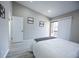 This bedroom has light filled interior, recessed lighting, and access to a private balcony at 1075 S Garrison St # 201, Lakewood, CO 80226