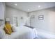 Bright bedroom with recessed lighting and access to a private bathroom at 1075 S Garrison St # 201, Lakewood, CO 80226