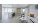 An open and airy living space with modern design, comfortable seating, and ample natural light at 1075 S Garrison St # 201, Lakewood, CO 80226