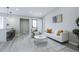 Open-concept living room with a modern design, light-colored flooring, and plenty of natural light at 1075 S Garrison St # 201, Lakewood, CO 80226