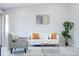 Bright living room features neutral tones, modern furnishings, and natural light at 1075 S Garrison St # 201, Lakewood, CO 80226