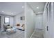 Cozy living room featuring modern decor and easy access to a hallway with closet and exterior access at 1075 S Garrison St # 201, Lakewood, CO 80226