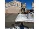 Two-story home with attached garage and snowy front yard at 6317 Wescroft Ave, Castle Rock, CO 80104