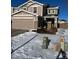 Two-story home with attached garage and snowy front yard at 6317 Wescroft Ave, Castle Rock, CO 80104