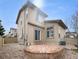 Home featuring a backyard with brick patio and landscaped yard at 10674 Cherrington St, Highlands Ranch, CO 80126