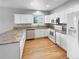 Well-equipped kitchen featuring white cabinetry, granite countertops, and stainless steel appliances at 10674 Cherrington St, Highlands Ranch, CO 80126