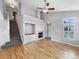 Bright living room with vaulted ceilings, fireplace, and hardwood floors at 10674 Cherrington St, Highlands Ranch, CO 80126