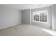 Neutral bedroom with large window and light carpet at 4626 Longs Ct, Broomfield, CO 80023