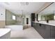 Luxury bathroom features a glass shower, soaking tub, double vanity, and modern fixtures at 5031 Moss Pl, Golden, CO 80403