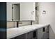 Bathroom vanity with dual sinks and modern black fixtures at 5031 Moss Pl, Golden, CO 80403