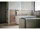 Bright bathroom with a standalone soaking tub and sleek black fixtures at 5031 Moss Pl, Golden, CO 80403