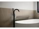 Close-up of a soaking tub with black faucet and fixtures at 5031 Moss Pl, Golden, CO 80403