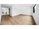 Bright bedroom featuring hardwood floors and modern black trimmed windows at 5031 Moss Pl, Golden, CO 80403
