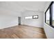 Bedroom with hardwood flooring and contemporary windows at 5031 Moss Pl, Golden, CO 80403