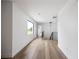 Hallway with hardwood floors, and plenty of natural light from large windows at 5031 Moss Pl, Golden, CO 80403