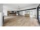 Open-concept living space with sleek hardwood floors and ample natural light showcasing modern design at 5031 Moss Pl, Golden, CO 80403