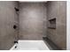 Shower with gray vertically-stacked tile and bench at 5031 Moss Pl, Golden, CO 80403