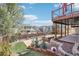 Backyard featuring a hot tub, deck, landscaped yard, and privacy fence at 11035 W Grand Pl, Littleton, CO 80127