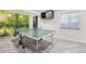 Finished basement features a ping pong table, stylish flooring, and a window with a natural view at 11035 W Grand Pl, Littleton, CO 80127