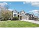 Well-maintained two-story home with a spacious front yard and a three-car attached garage at 11035 W Grand Pl, Littleton, CO 80127