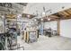 Spacious garage with workbench, storage, and overhead lighting at 11035 W Grand Pl, Littleton, CO 80127
