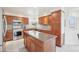Beautiful kitchen with stainless steel appliances, granite countertops, and custom cabinetry at 11035 W Grand Pl, Littleton, CO 80127