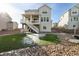 Back of home view highlighting upper level balcony and artifical turf at 1171 E Hopkins Dr, Elizabeth, CO 80107