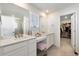 Double vanity bathroom with walk-in closet at 1171 E Hopkins Dr, Elizabeth, CO 80107