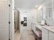 Main bathroom with double vanity and shower at 1171 E Hopkins Dr, Elizabeth, CO 80107