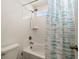 Simple bathroom with shower/tub combo and window at 1171 E Hopkins Dr, Elizabeth, CO 80107